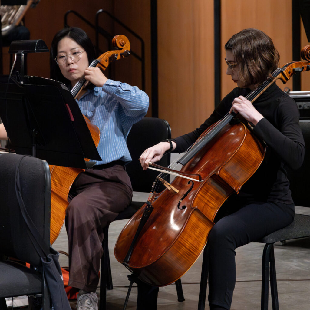 Women playing Cello at Adult class.
